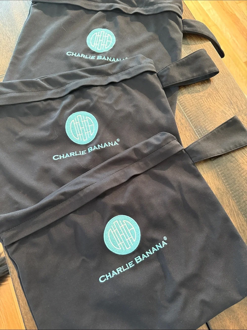 Charlie Banana Black Wet Bags with Teal Logo